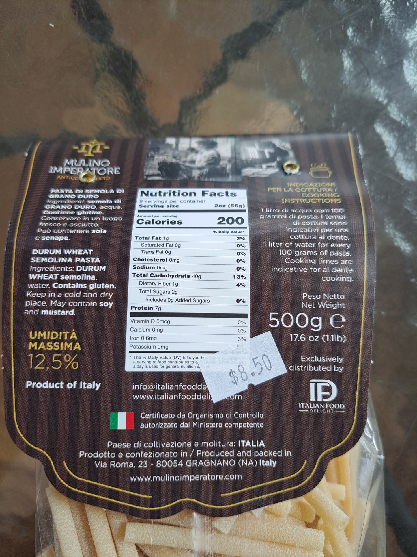 Pasta package with nutritional information and brand details on a reflective surface