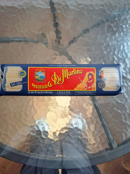 Box of Di Martino pasta on a glass table
