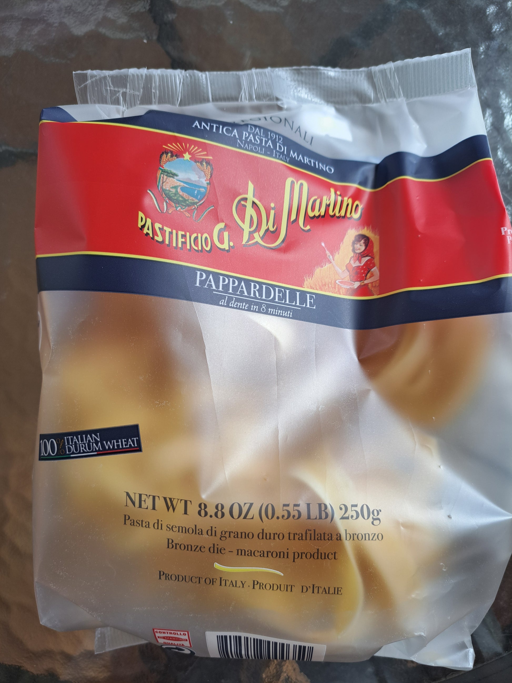 Package of Di Martino pasta on a reflective surface