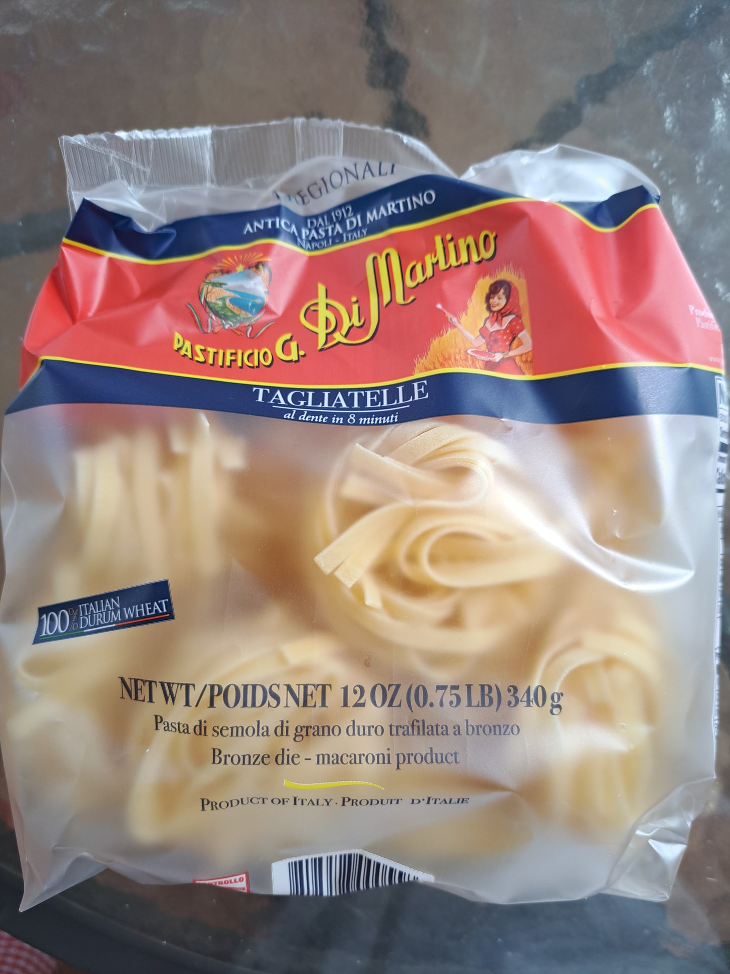 Package of Di Marino tagliatelle pasta on a reflective surface