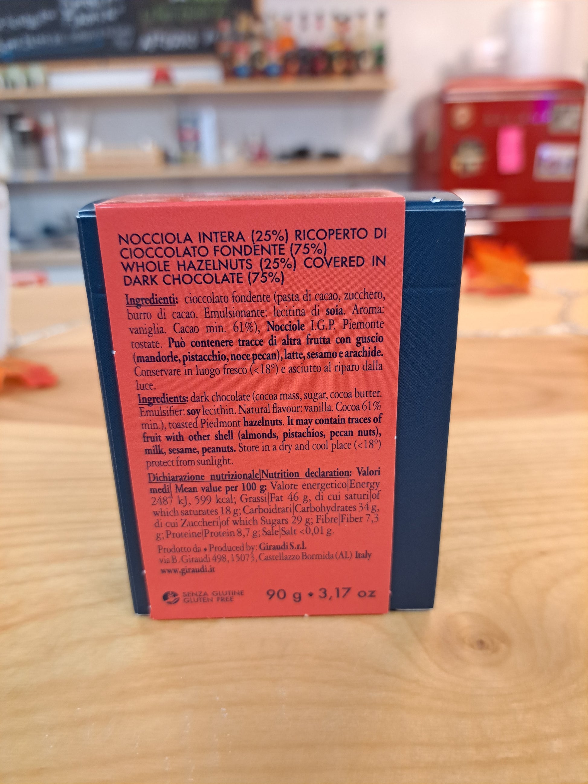 Book with red and blue cover on a wooden surface