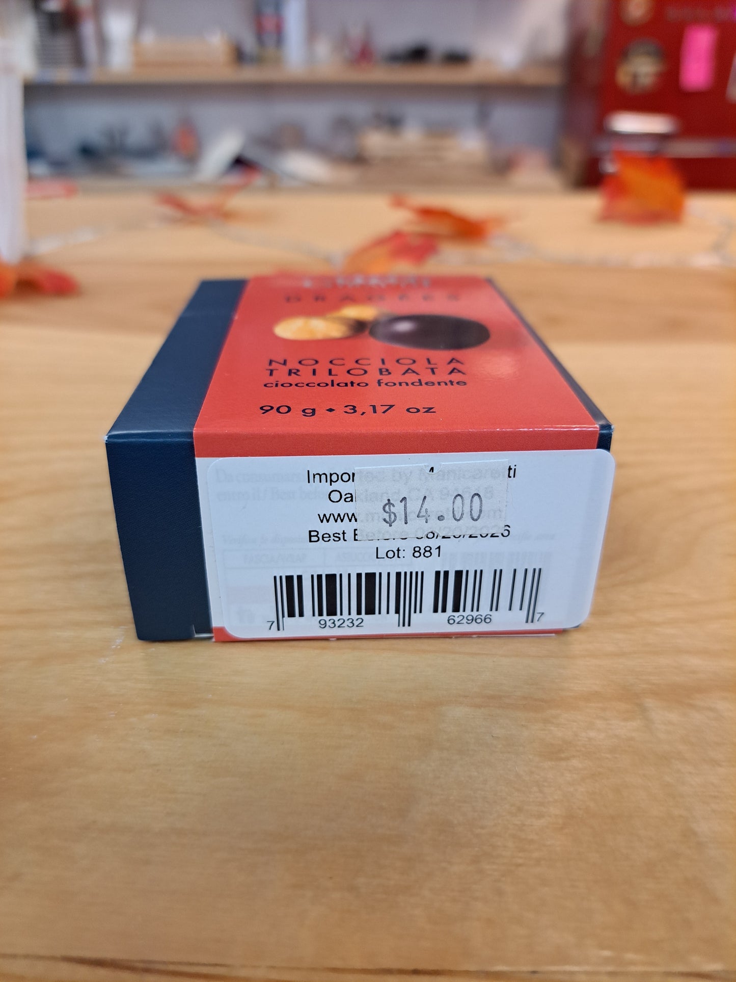 Chocolate packaging with a barcode and price on a wooden surface