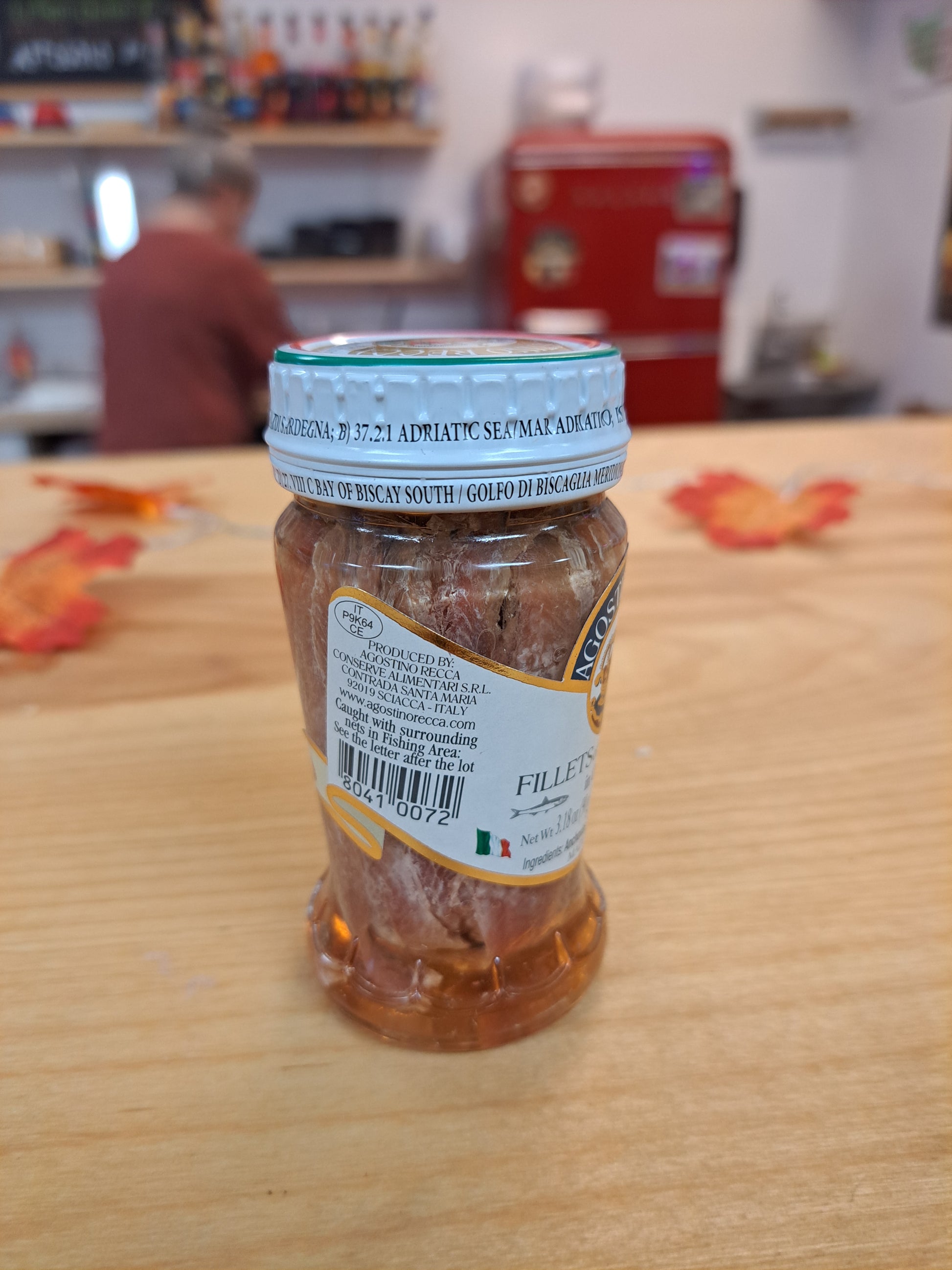 Jar of food on a wooden surface with a blurred background
