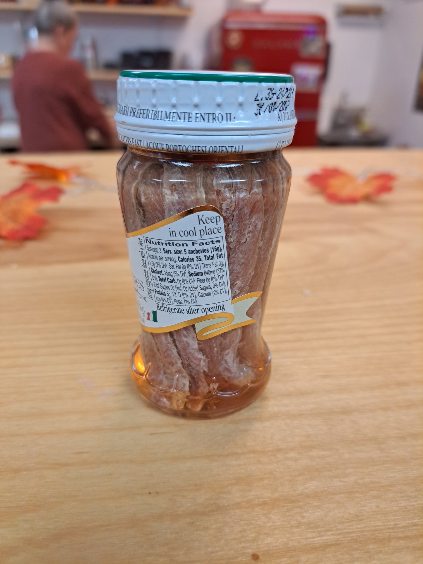 Jar of Fillets of Anchovies on a wooden surface