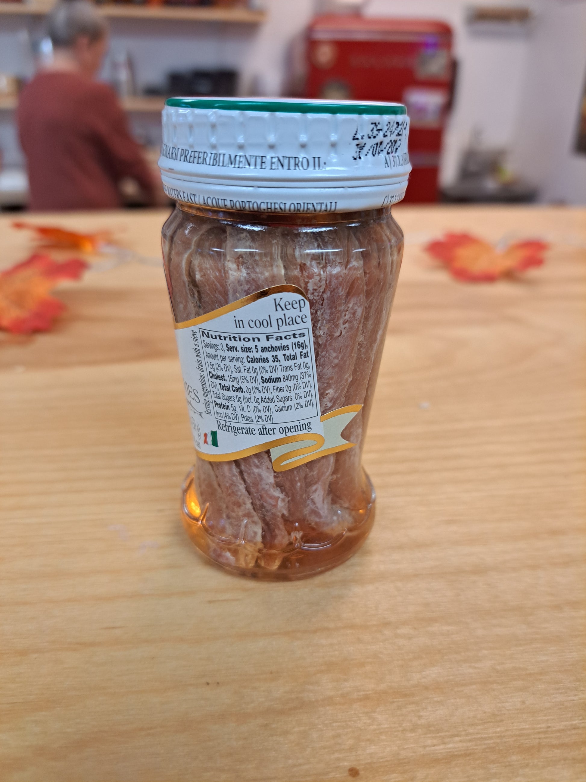 Jar of Fillets of Anchovies on a wooden surface