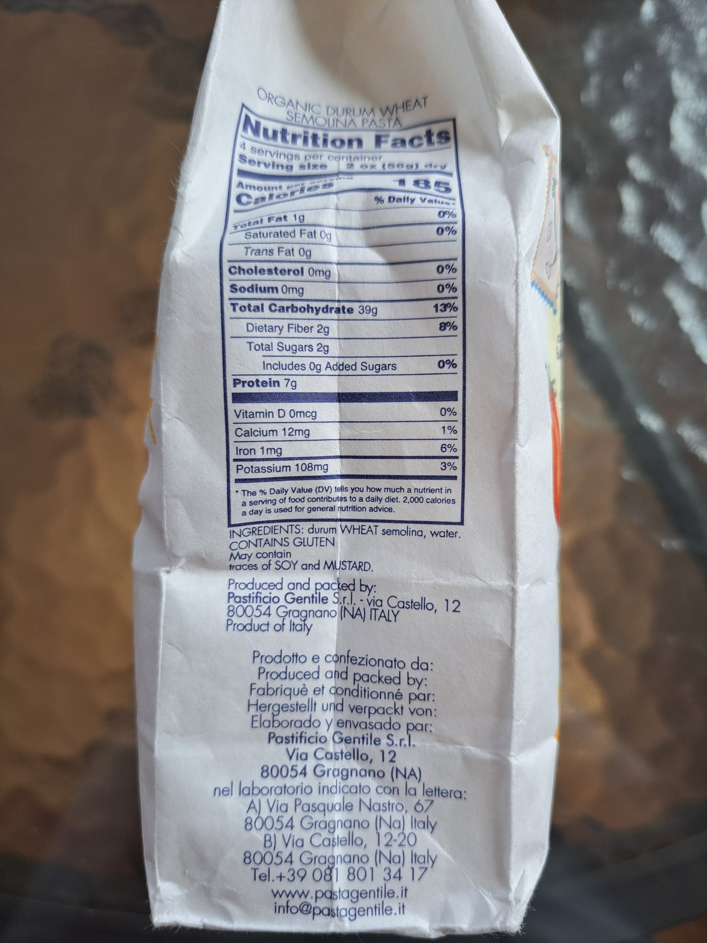 Close-up of a pasta package with nutrition facts label on a blurred background