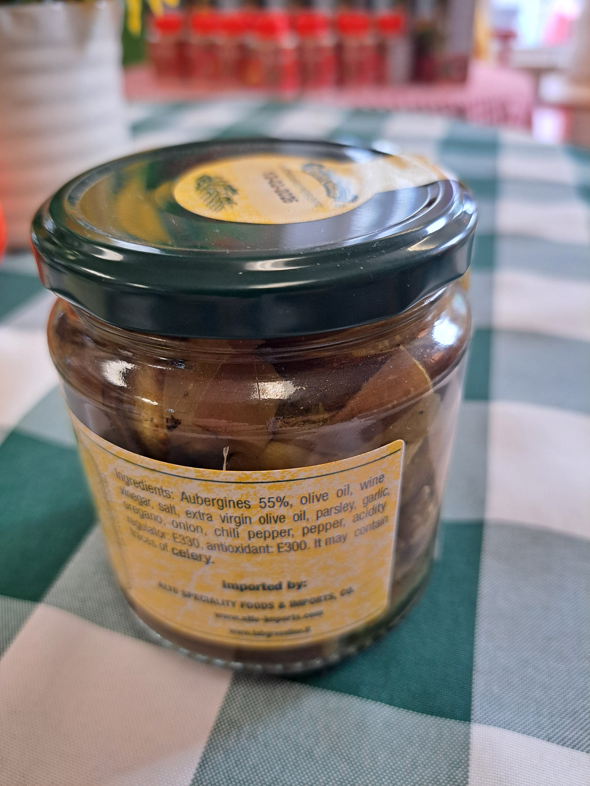 Jar of pickled vegetables on a checkered tablecloth