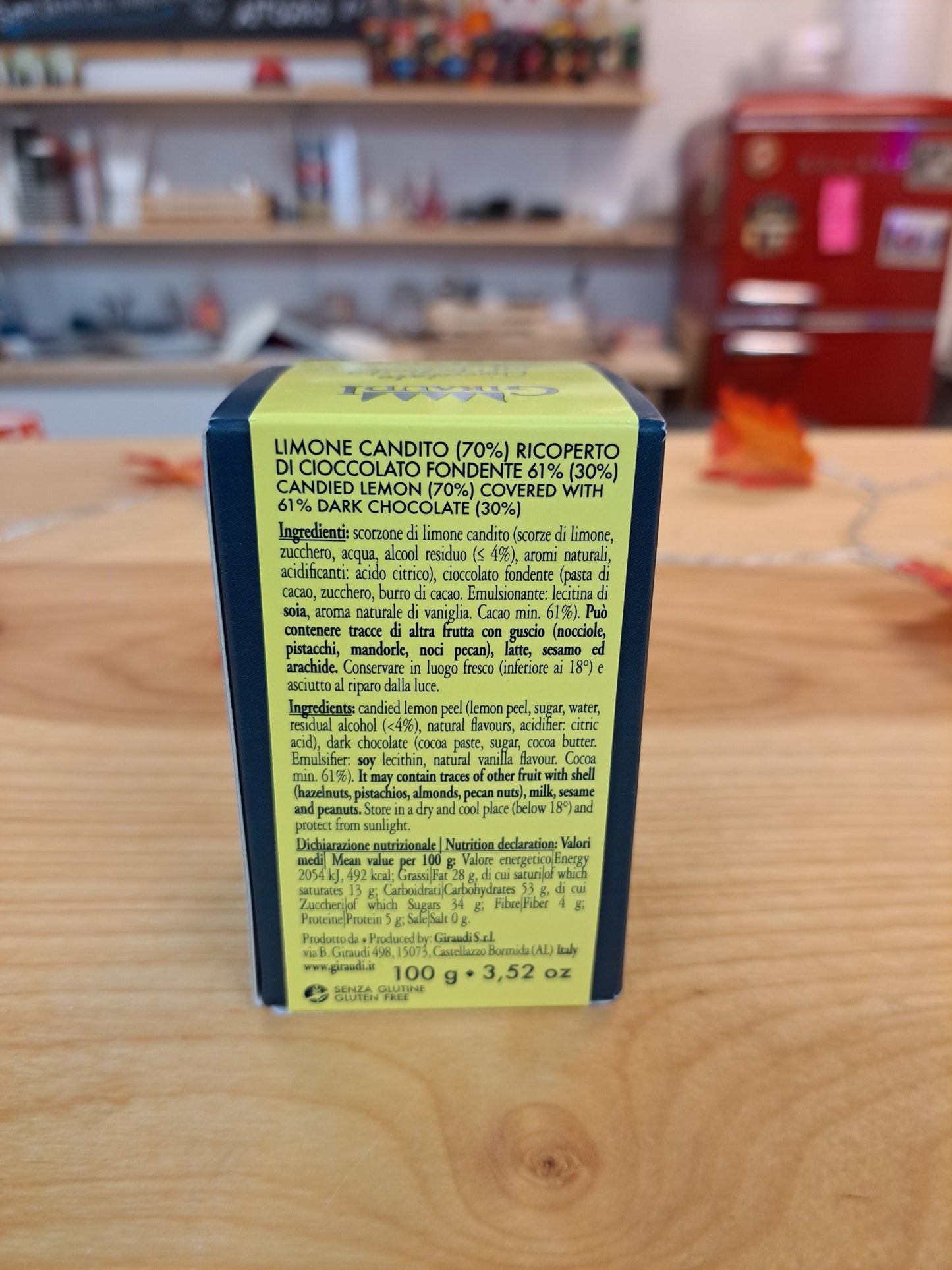 Yellow and black box with text on a wooden surface