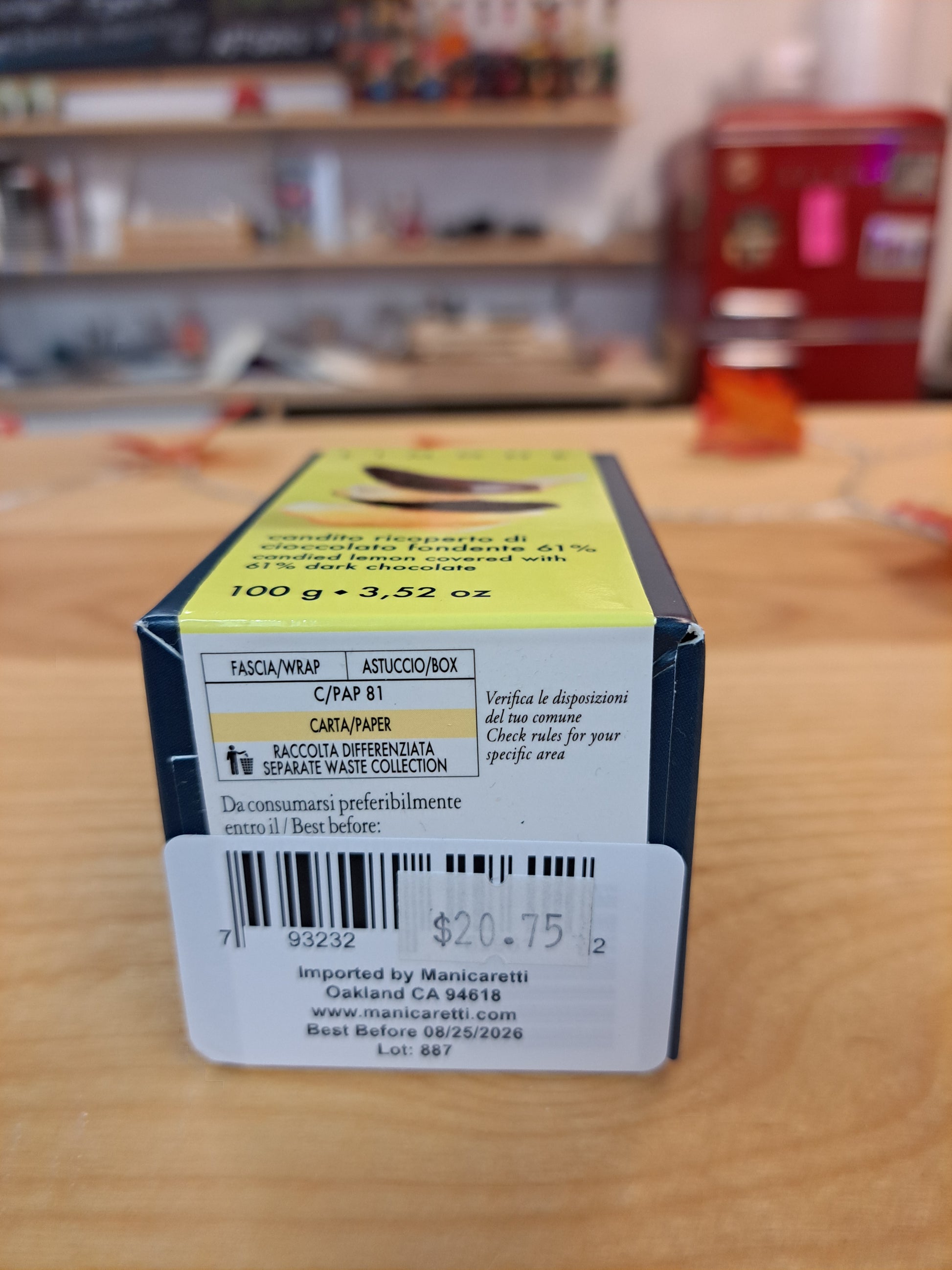 Product packaging with a label on a wooden surface