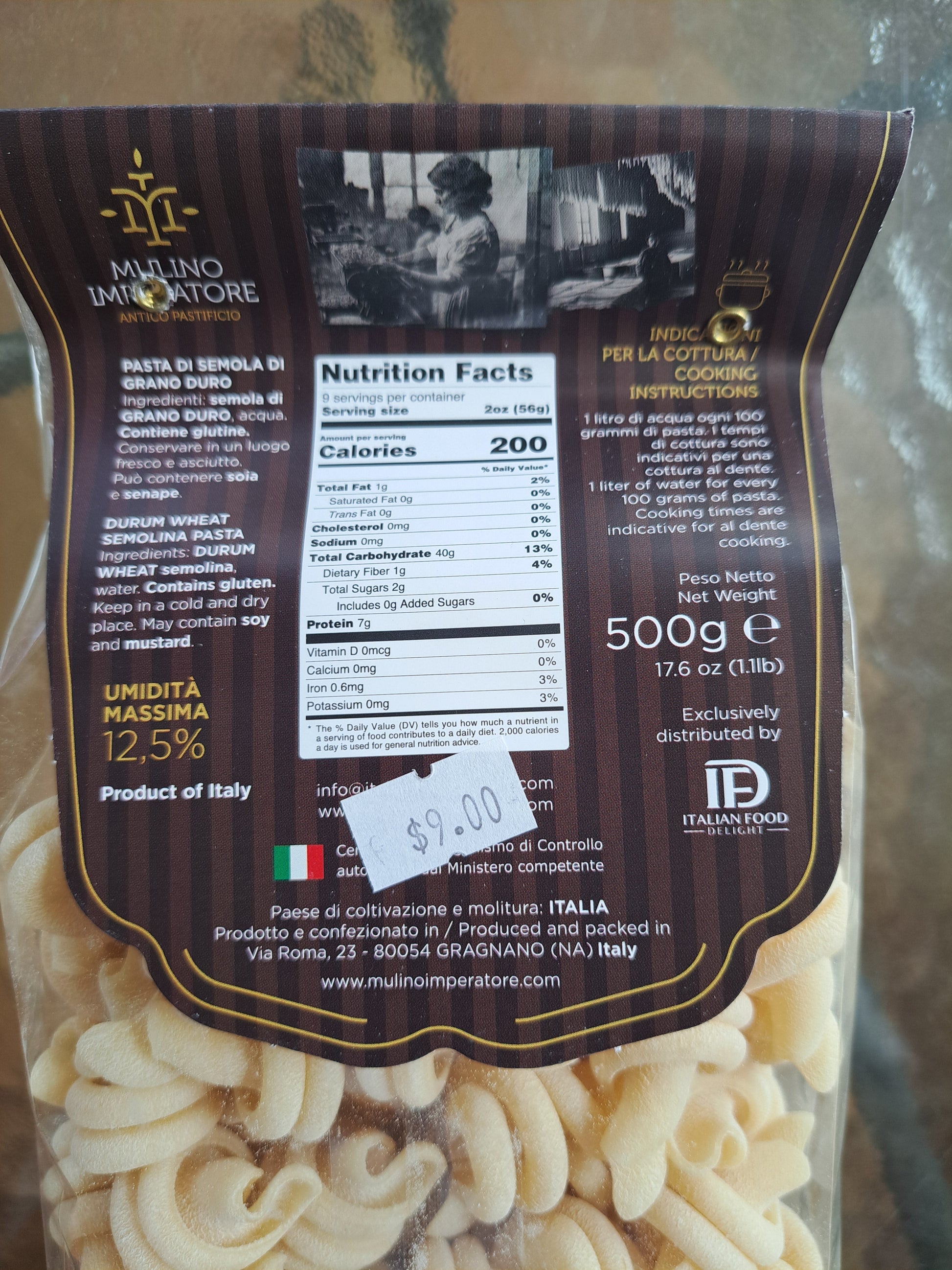 Pasta package with nutritional information and brand logo on a reflective surface