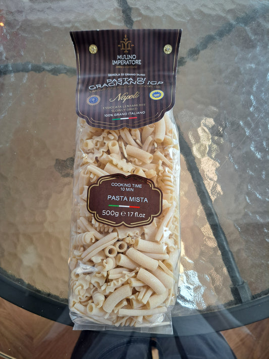 Packaged pasta with a brand label on a reflective surface