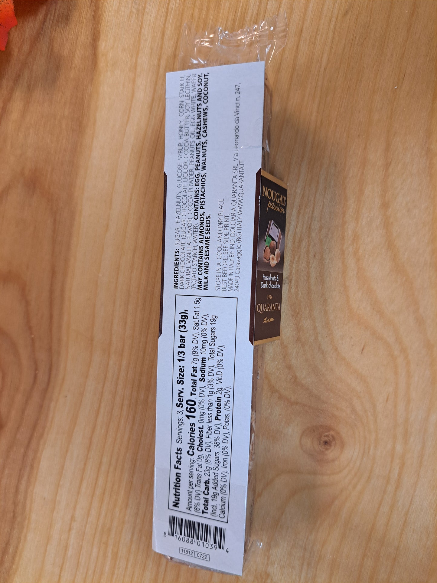 Product packaging with text on a wooden surface