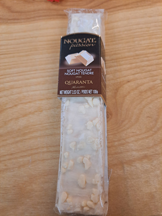 Packaged nougat on a wooden surface