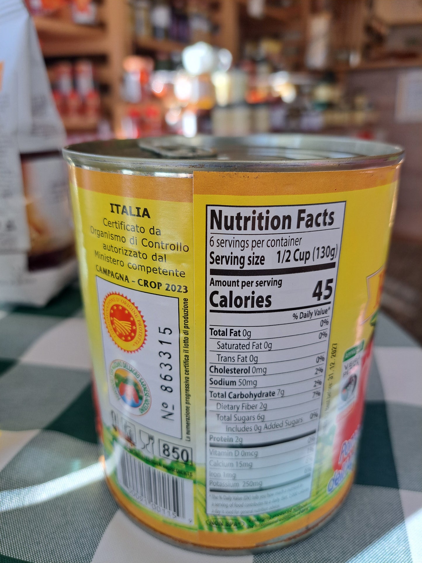 Can with nutrition label and colorful design on a blurred background
