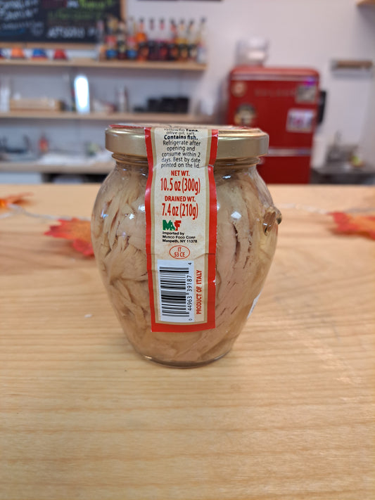 Jar of Solid Light Tuna with a label on a wooden surface