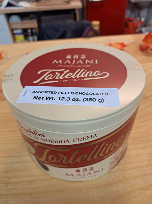 Tortellino Majani chocolate tin on a wooden surface