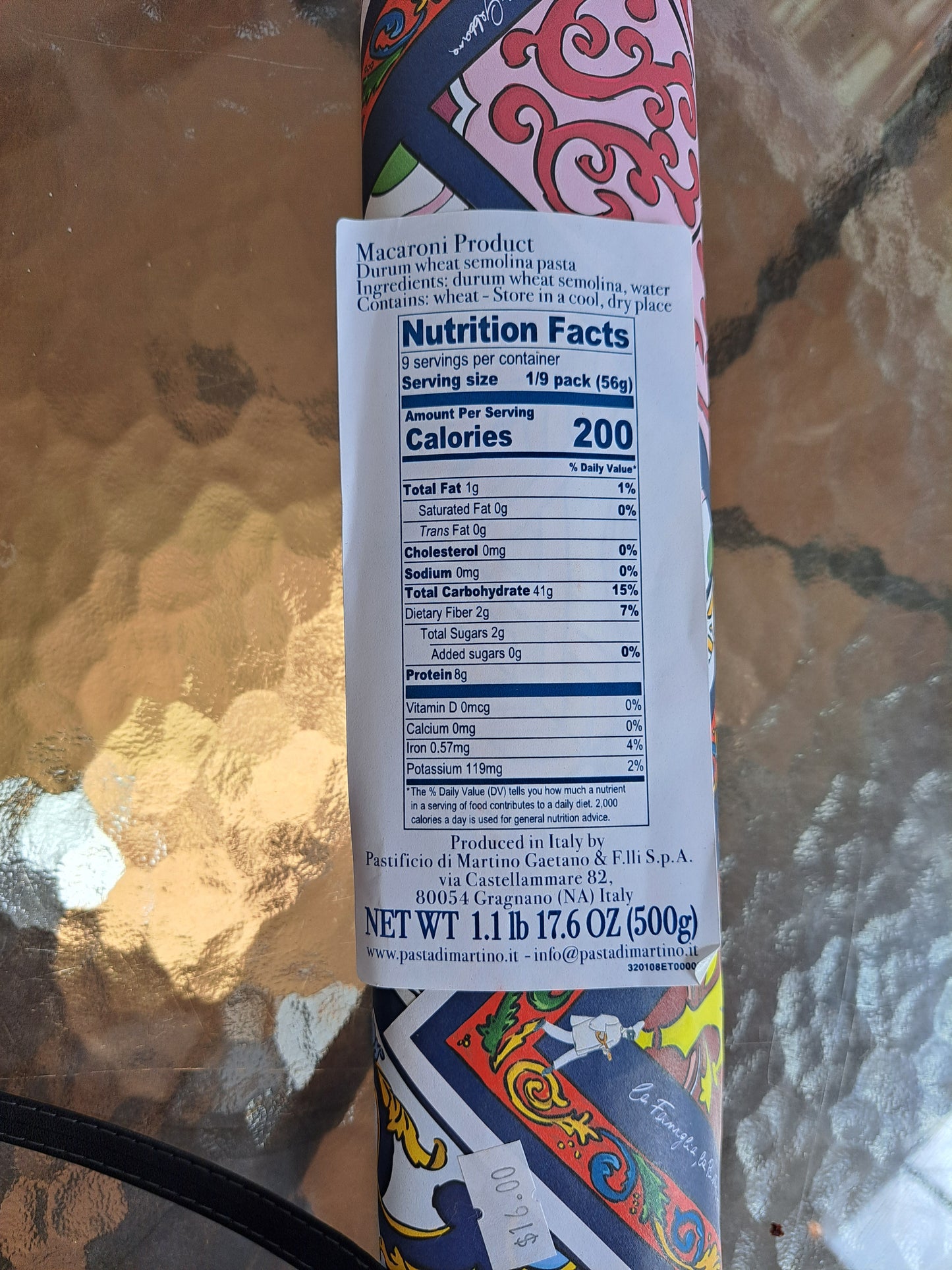 Pasta package with nutrition facts label on a reflective surface